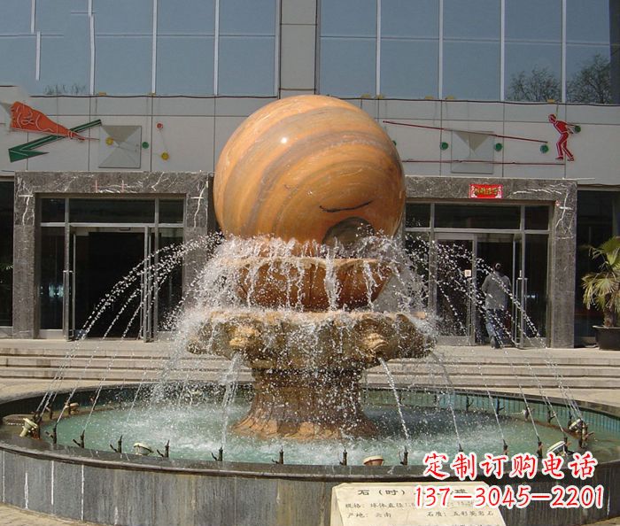 吉林石来运转球晚霞红风水球石雕